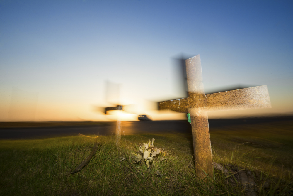Backlit Cross on a Roadside